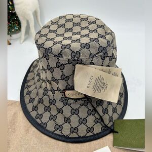Men’s Gucci, GG reversible,horse bit and  bucket hat, size medium, made in Italy